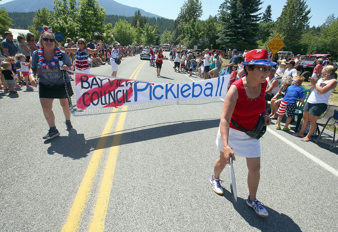 Raquel Kellicut, right, walks with the Bayview Council Pickleball unit in the Bayview Daze parade.