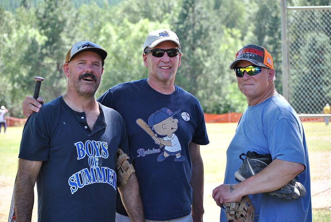 Bill Andrews, Mark Fields of St. Regis, and Craig Martin have been playing softball together for more than 30 years. During this years annual Firecracker Classic softball tournament over the fourth of July weekend in St. Regis, these old friends played on the team called the St. Regis Syrup's, a nod to the classic Charlie Brown's baseball team. (Amy Quinlivan/Mineral Independent)