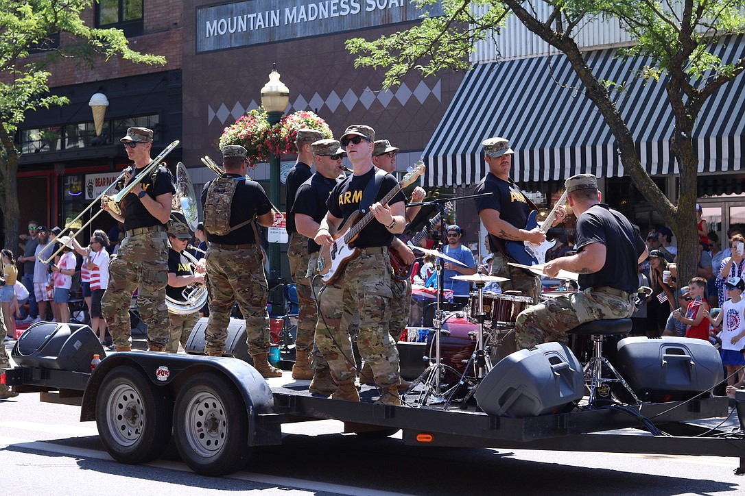 Members of the National Guard play for the Fourth of July parade in downtown Coeur d'Alene on Sunday. HANNAH NEFF/Press