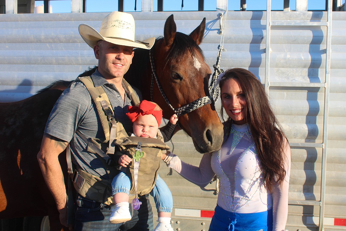 Shane Proctor (left), Coulee Proctor(center) and Haley Proctor (right) pose by their trailer at the Coulee City PRCA Last Stand Rodeo on Memorial Day weekend.