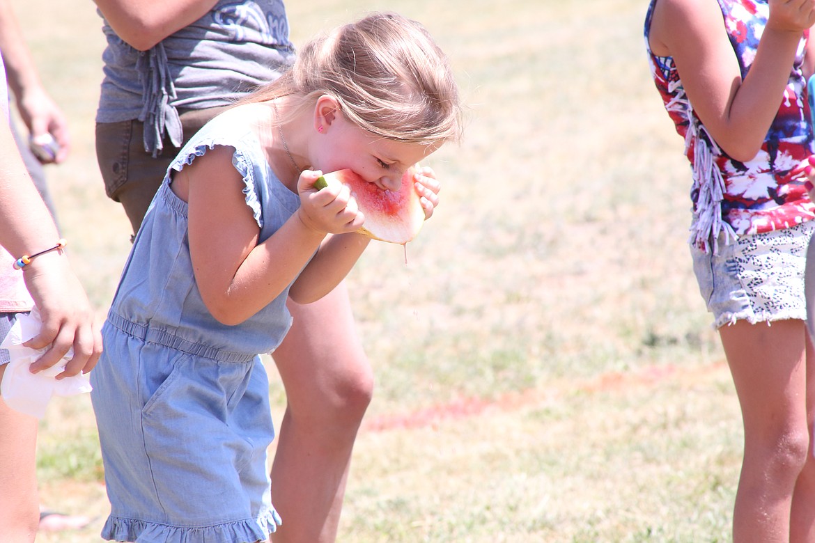 Community members of all ages participated in the watermelon eating contest during the Old Fashioned Fourth of July Celebration in Clark Fork sponsored by the Rod and Gun Club.