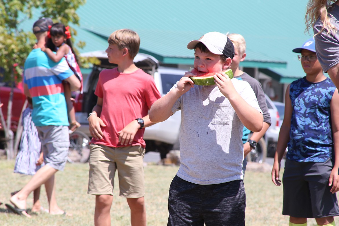 Community members of all ages participated in the watermelon eating contest during the Old Fashioned Fourth of July Celebration in Clark Fork sponsored by the Rod and Gun Club.