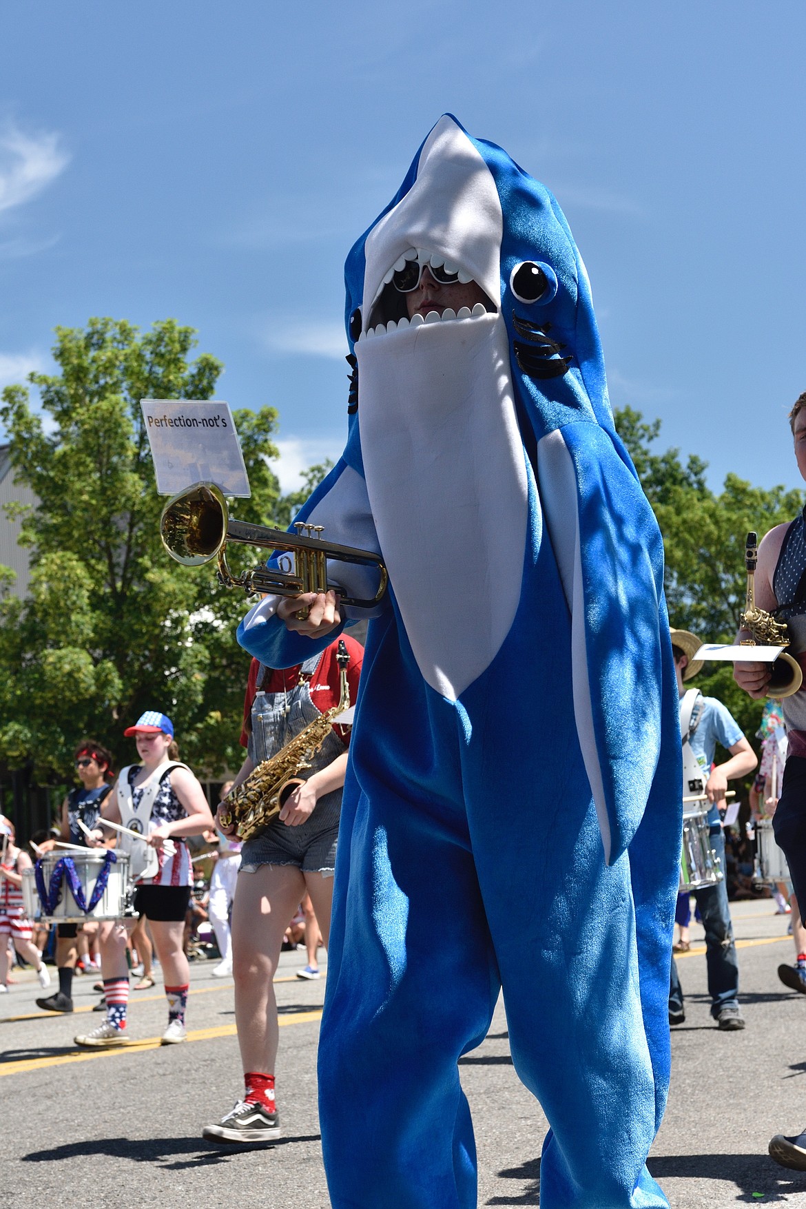 Left Shark, who marched on the left side of the formation, plays trumpet for the Perfection-Nots. JIM MOWREADER/Press