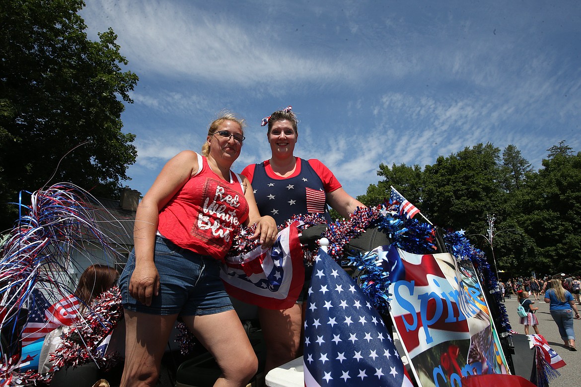 Angel Stubbs and Jeneva Stubbs, with the Spirit Event Committee that organized Spirit Lake's Fourth of July parade, pose at the end of the parade.