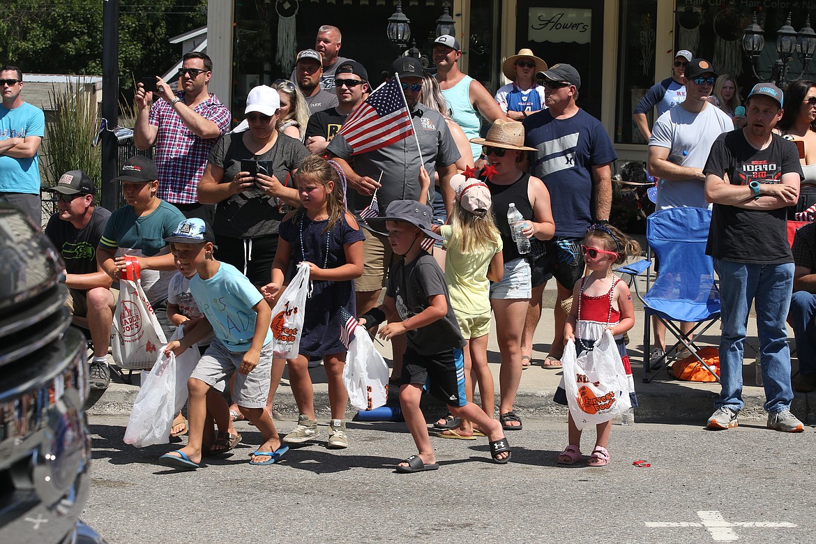Kids go after candy during Spirit Lake's Fourth of July parade.