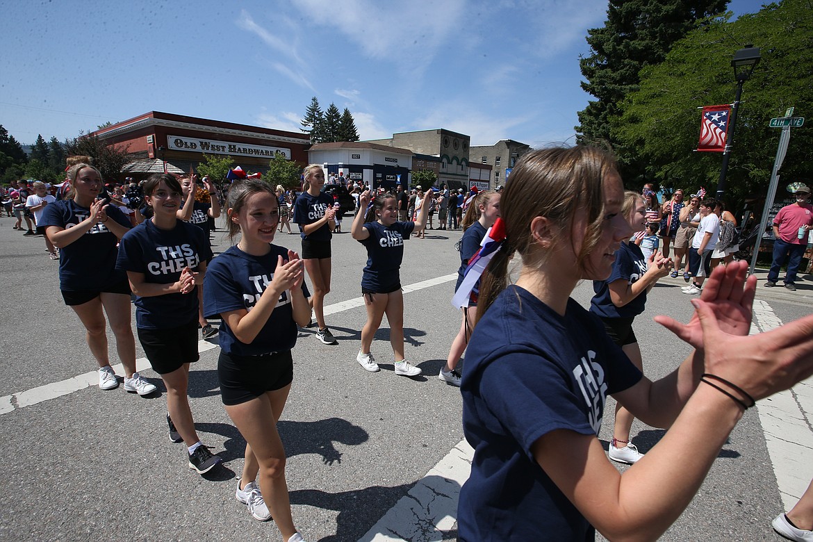TimberLake High School cheerleaders clap during Sunday's Fourth of July parade in Spirit Lake.