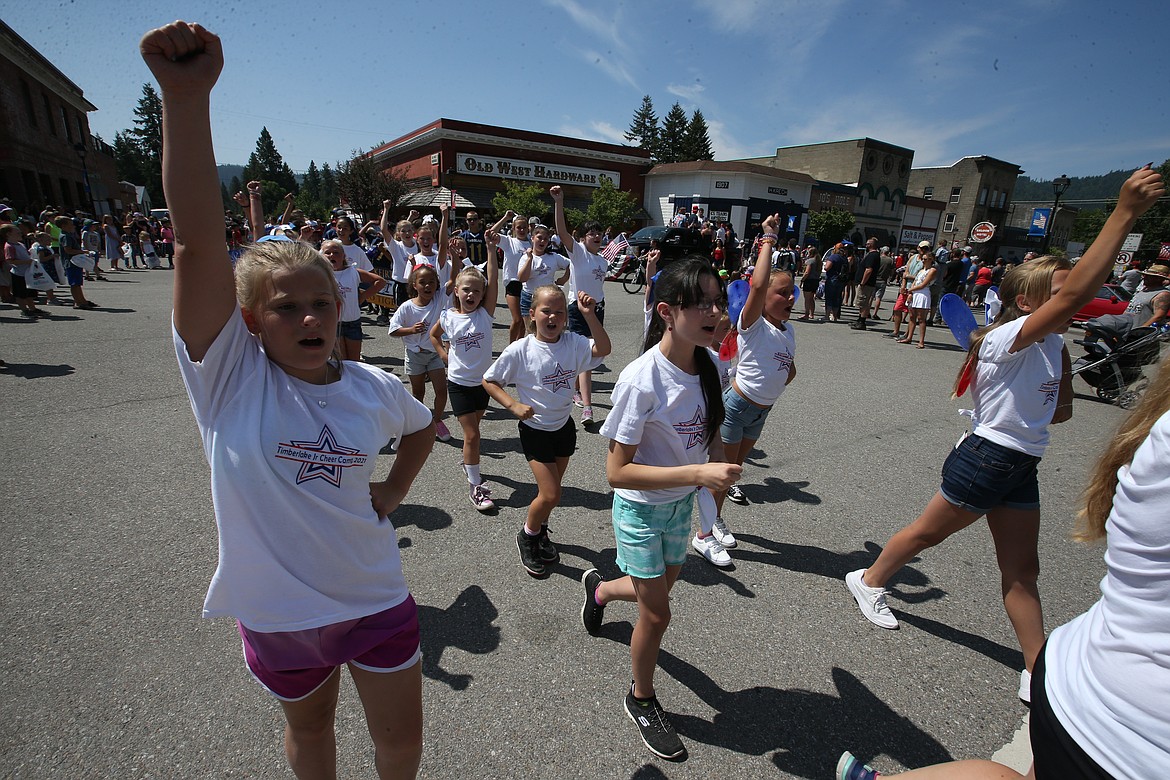 Timberlake Junior Cheer Camp members perform a routine during Spirit Lake's Fourth of July parade.