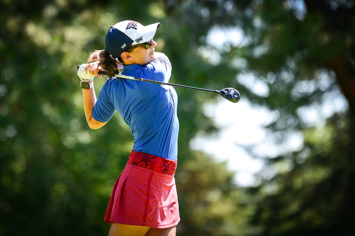 Jasi Acharya watches her tee shot on the eighth hole of the North Course during the third round of the Earl Hunt 4th of July Tournament at Whitefish Lake Golf Club on Saturday, July 3. (Casey Kreider/Daily Inter Lake)