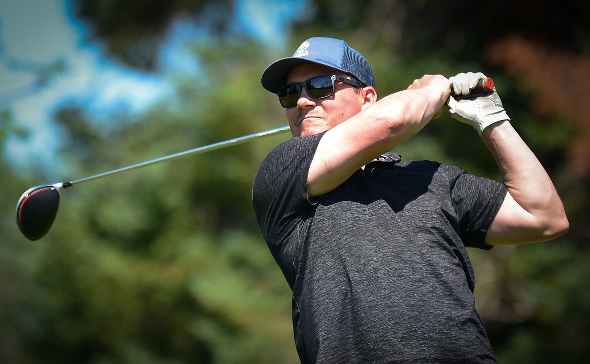 Dan Conkling, of Whitefish, watches his drive off the first tee of the South Course during the opening round of the Earl Hunt 4th of July Tournament at Whitefish Lake Golf Club on Thursday, July 1. (Casey Kreider/Daily Inter Lake)