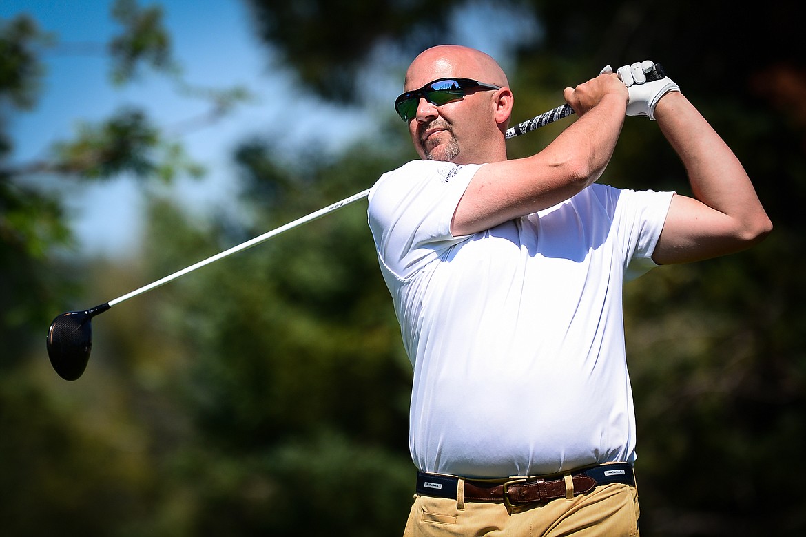 Shawn Tucker, of Whitefish, watches his drive off the first tee of the South Course during the opening round of the Earl Hunt 4th of July Tournament at Whitefish Lake Golf Club on Thursday, July 1. (Casey Kreider/Daily Inter Lake)