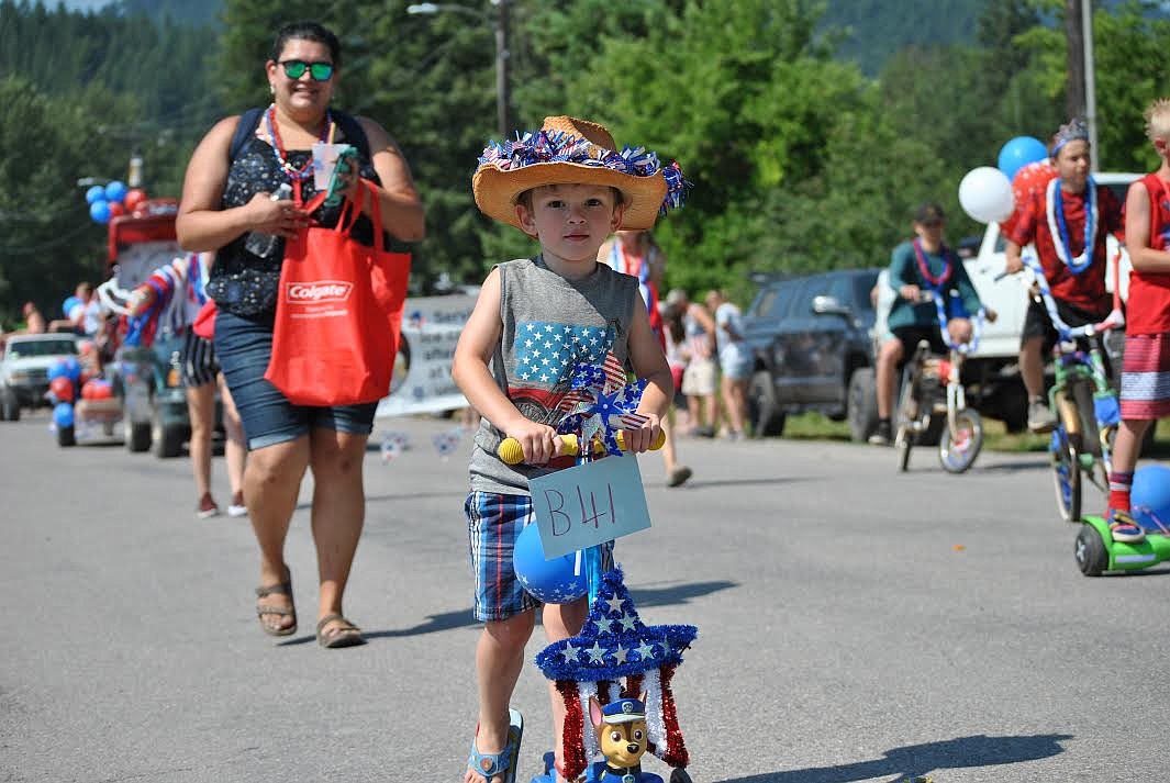 Veronica Frye's son, Ian, entered the St. Regis July 4 parade on his decked out Paw Patrol Scooter and wore his patriotic cowboy hat. (Amy Quinlivan/Mineral Independent)