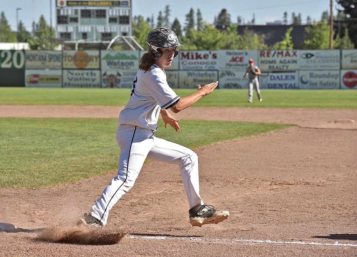 Glacier Twins player George Robbins rounds first base while watching the ball as he decides to continue on to second after a hitting a double in a home game against the Kalispell Lakers A on Wednesday, June 30. (Whitney England/Whitefish Pilot)
