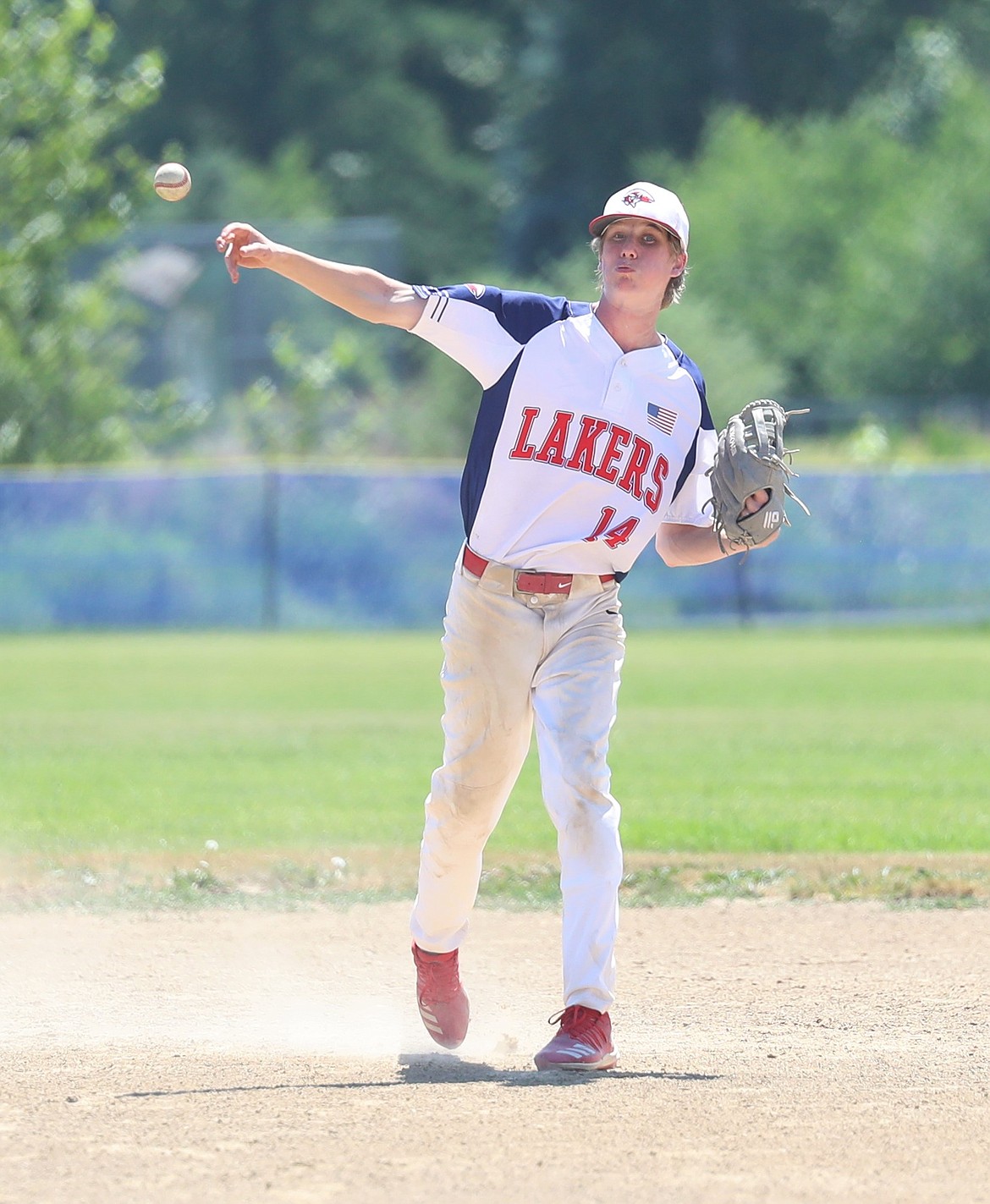 Alex Leverich makes a throw to first last year.