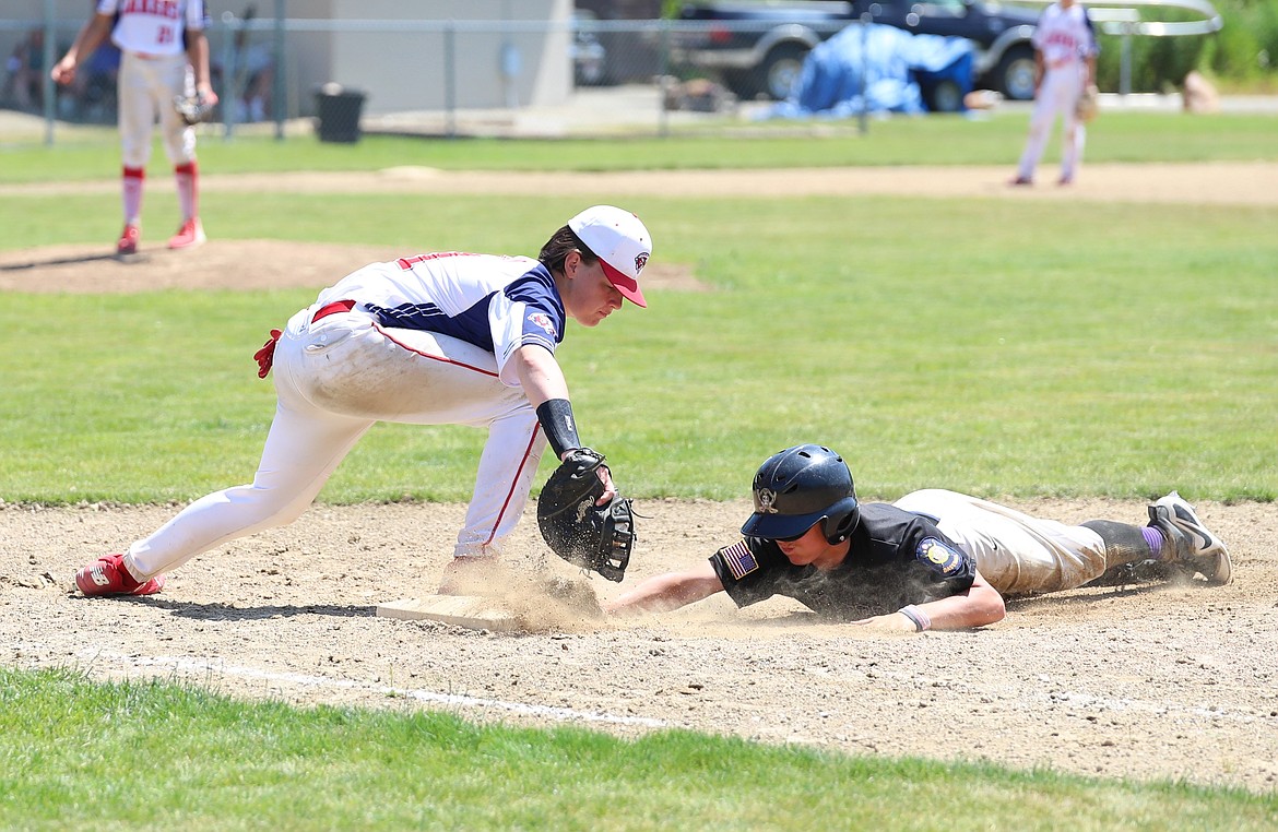 First baseman Jacob Hansen tags a Rogers base runner to record an out Saturday.