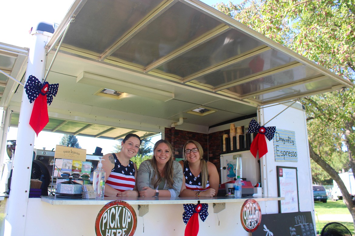 Left to right: sisters Brandi Russell, Brittany Lutz and Mckinzie Bottineau of Dragonfly Espresso serve coffee at the Moses Lake Freedom Fest on Sunday.