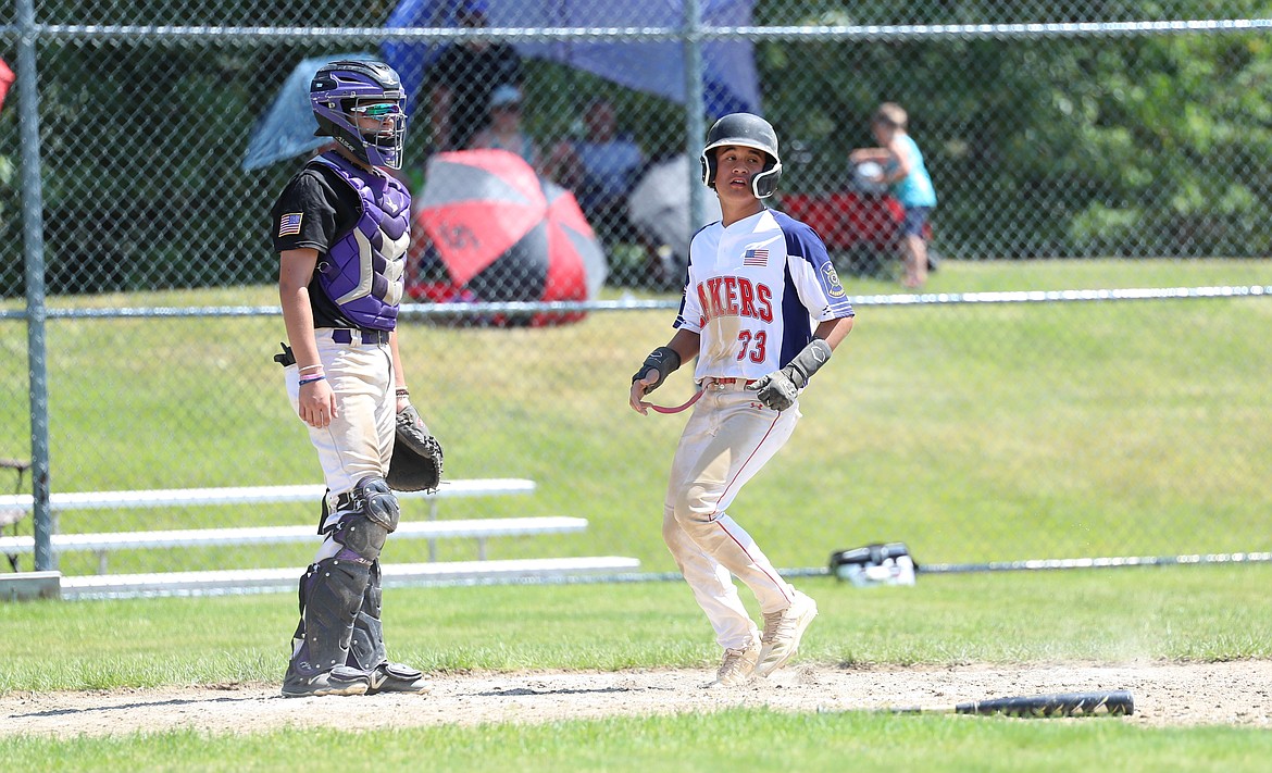 Kaipoi Wong-Yuen crosses home plate on Saturday.