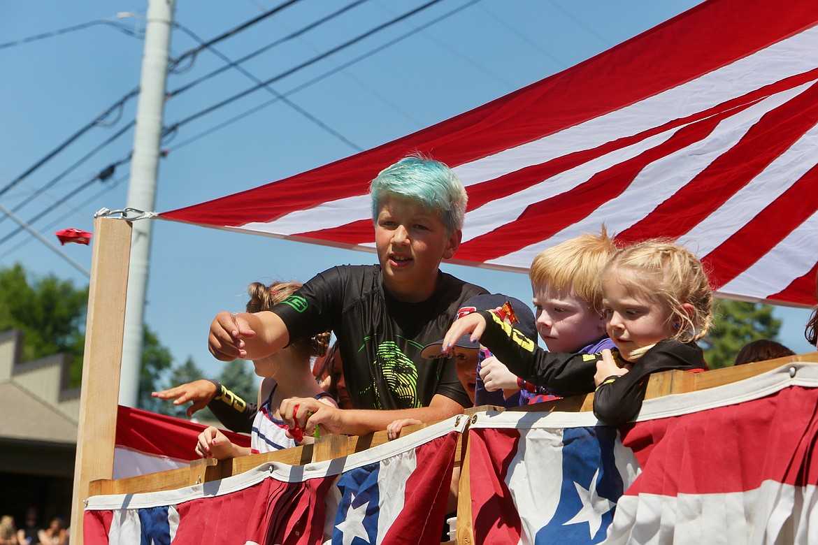 Kids toss candy to attendees during the Bigfork Fourth of July Parade.
Mackenzie Reiss/Bigfork Eagle