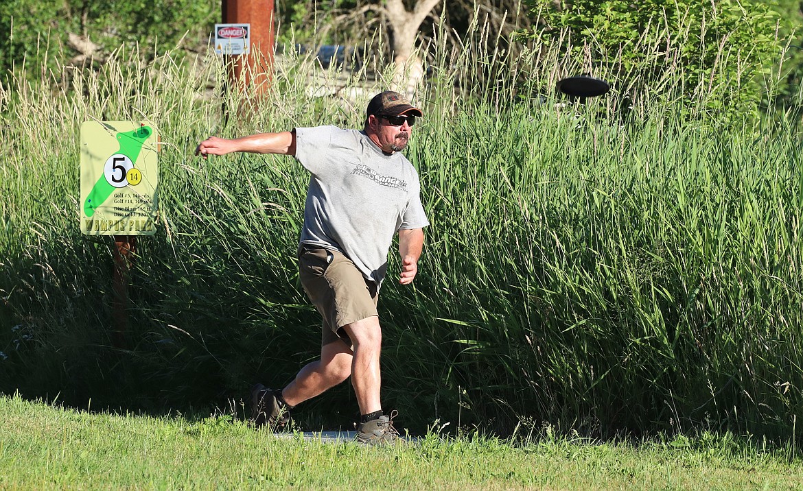 Scenes from Monday's Wampus Park disc golf tourney.