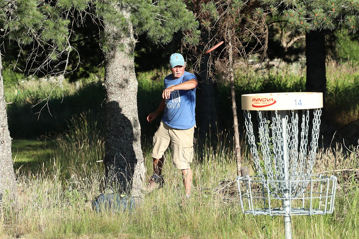 Scenes from Monday's Wampus Park disc golf tourney.