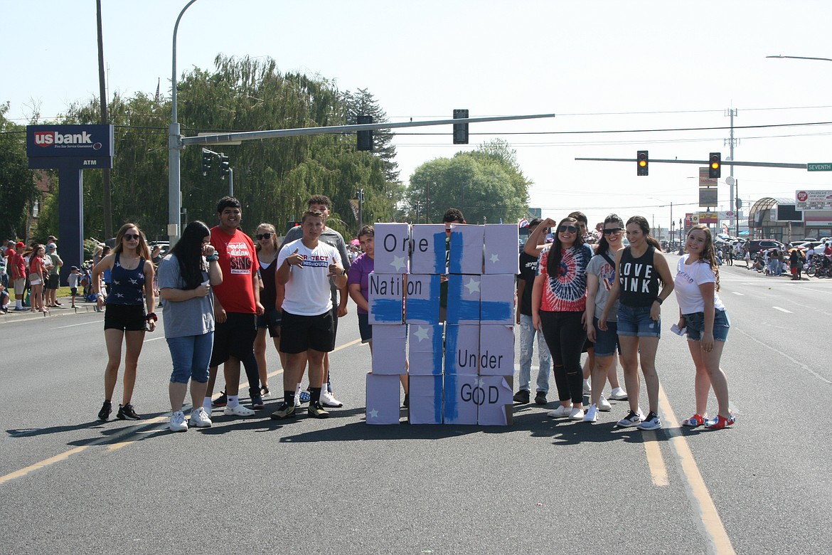 Members of an Othello church youth group used boxes as puzzle pieces to make their statement during the Independence Day parade in Othello July 3.
