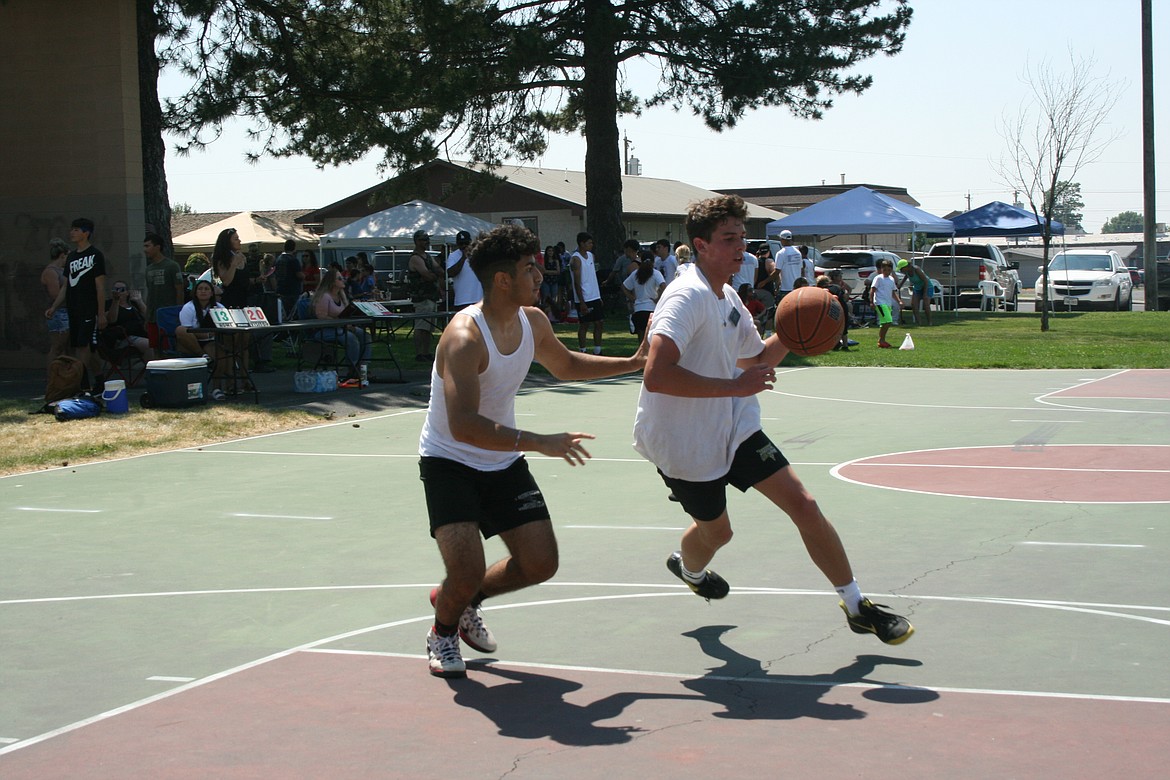 A player goes up for a layup during the three-on-three basketball tournament at the Independence Day celebration in Othello July 3.