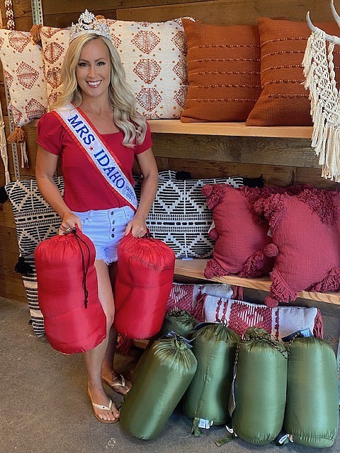 Mrs. Idaho 2021 Griffen Turnbull holds a few of the sleeping bags collected for Heritage Health for the homeless. Giving back to the community inspires her.