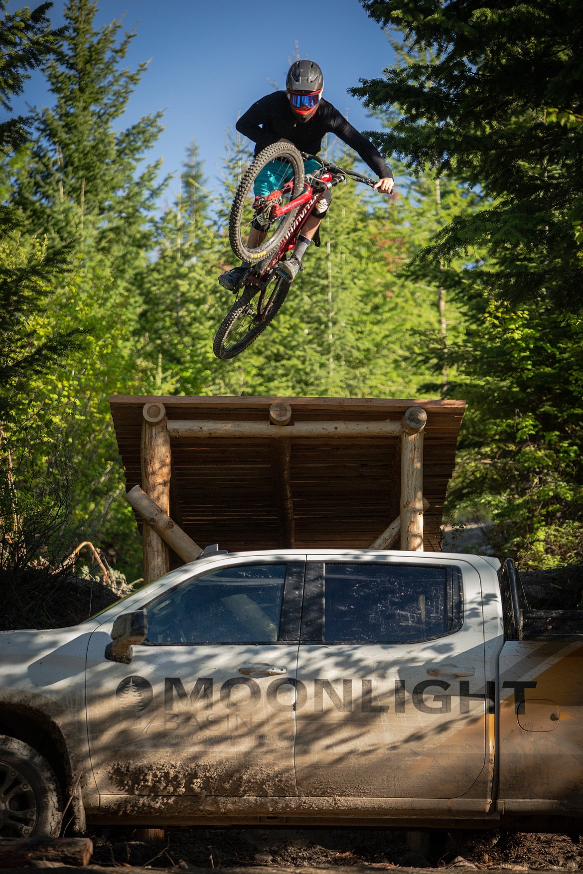 Parkin Costain jumps a 20-foot road gap at Legacy Bike Park (photo credit: Mitchell Bryan).