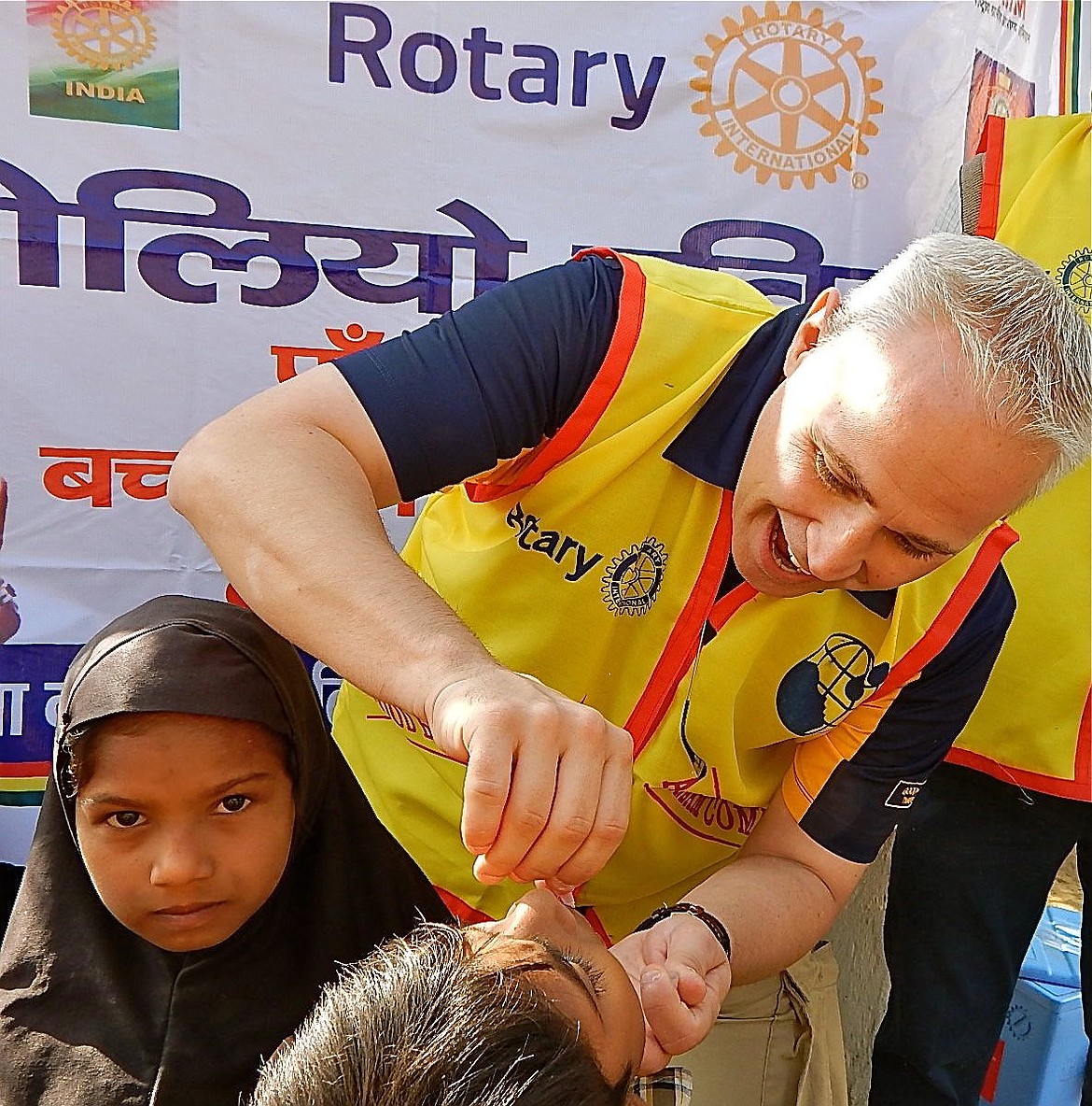 On  the semi-annual National Immunization Day in Rajasthan, India, Clint Schroeder administers the oral polio vaccine to a child in the north western village of Nuh. May 2015.