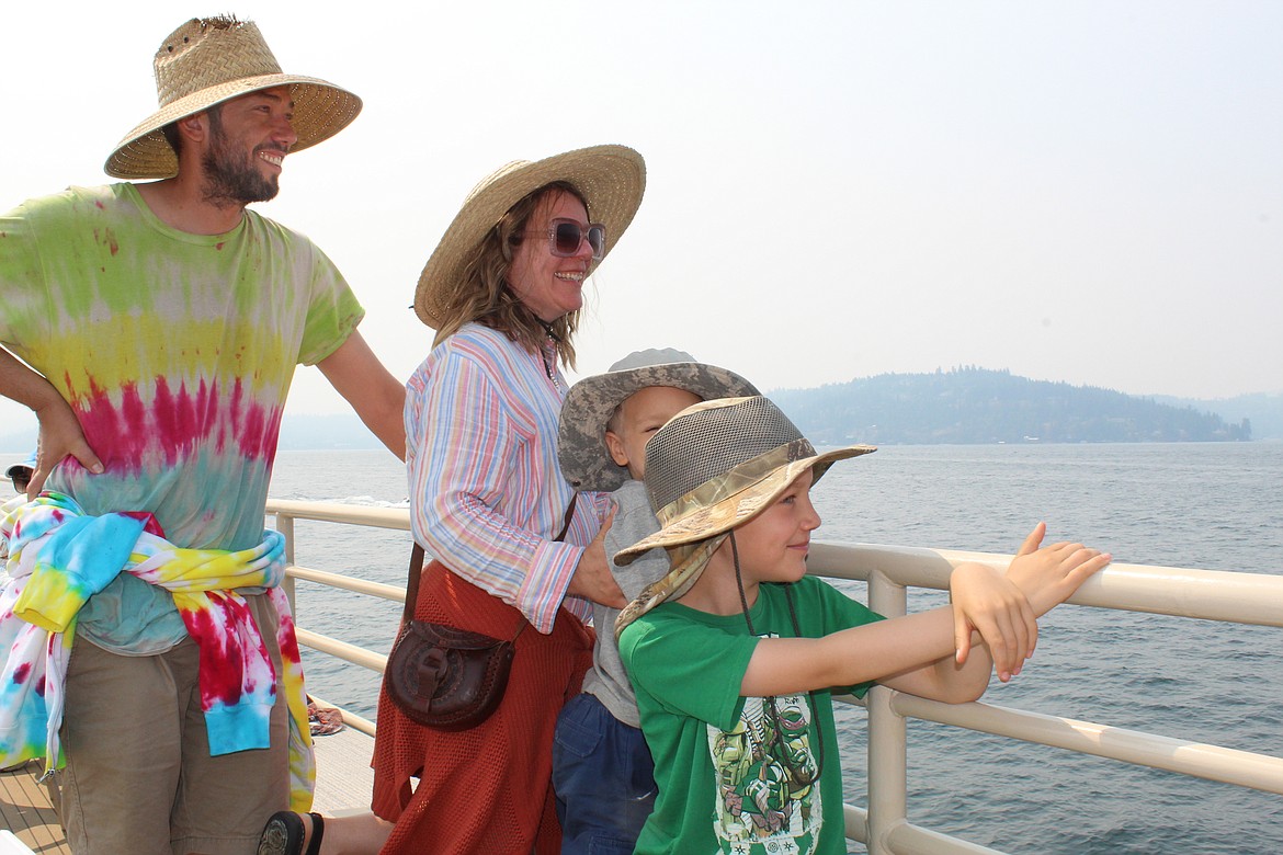 JOEL DONOFRIO/Press
From left, Rob Bjerke, Maureen O'Connell, Finn Bjerke and Hugo Bjerke, all of St. Maries, enjoy the sights during Saturday's Osprey Cruise on Lake Coeur d'Alene.