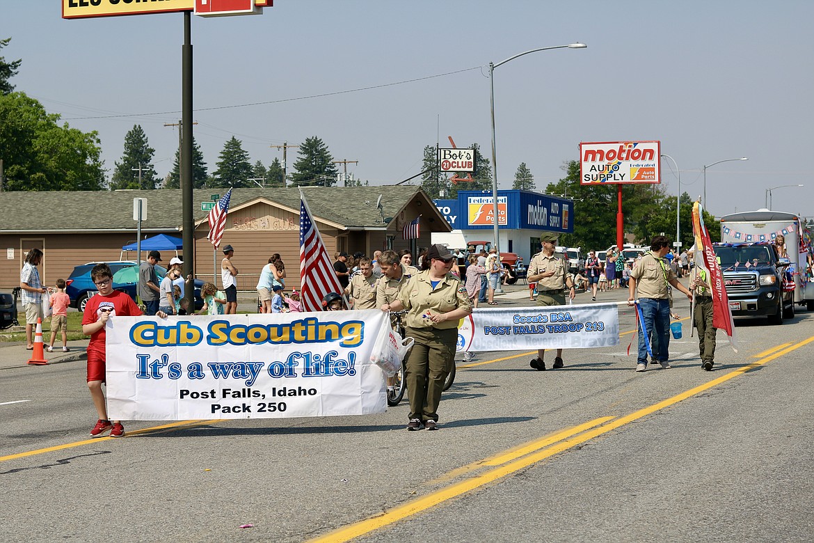 Cub Scouts Pack 250 march up Seltice Way during the Post Falls Festival parade Saturday morning. HANNAH NEFF/Press