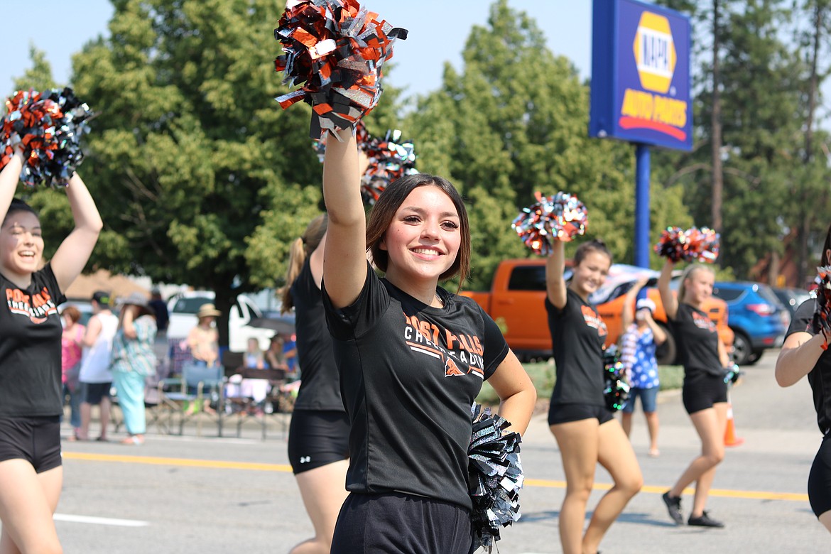 Jayceana Blodgett, 16, a senior and cheerleader at Post Falls High School marches in the Post Falls Festival parade Saturday morning. HANNAH NEFF/Press