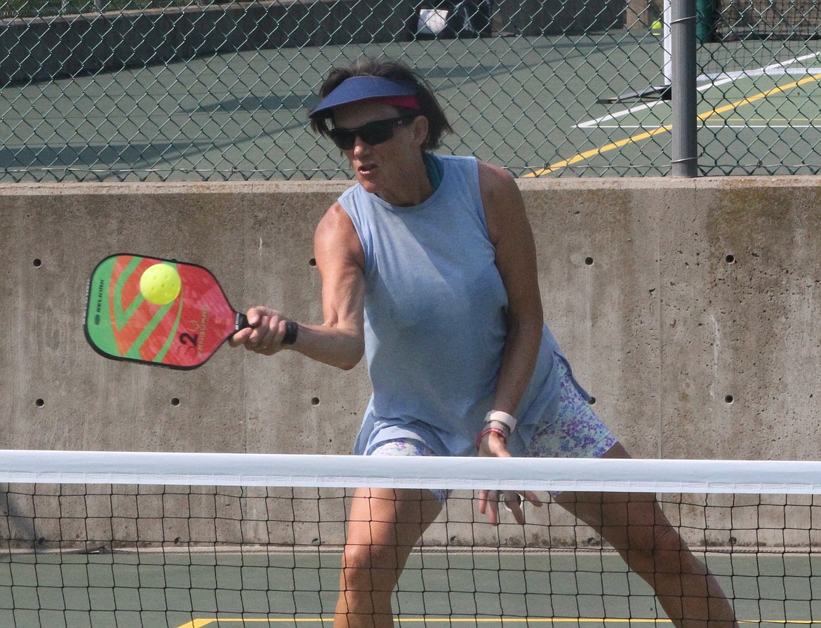 MARK NELKE/Press
Julie Billetz of Post Falls reaches for a shot in the gold medal match in the mixed doubles 4.0 60-plus division at the Coeur d'Alene Classic pickleball tournament Saturday at Cherry Hill Park. The four-day tournament, which attracted 314 entrants, began Thursday with women's doubles, continued Friday and Saturday with mixed doubles brackets, and concludes today with men's doubles. Play today begins at 8 a.m., and figures to run through mid- to late-afternoon.