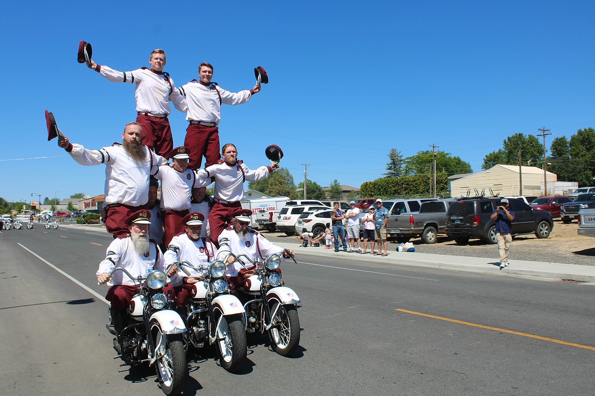 The Seattle Cossacks Motorcycle Stunt and Drill Team forms a pyramid at the Royal City Summerfest on Saturday.