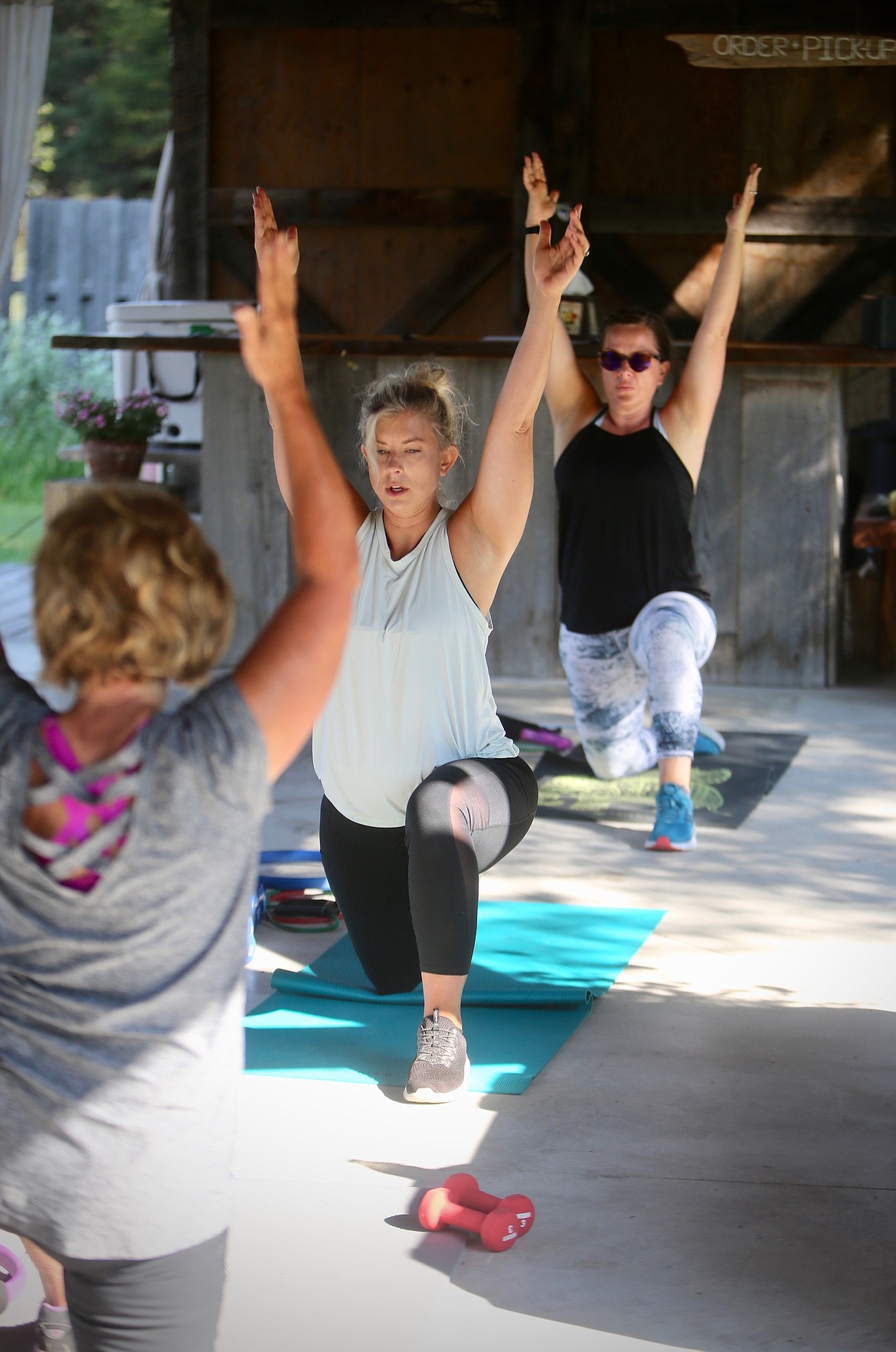 Participants finish Candus Suppelsa's strength and toning class with a series of stretches at The Nest on Swan River, Monday morning. 
Mackenzie Reiss/Bigfork Eagle