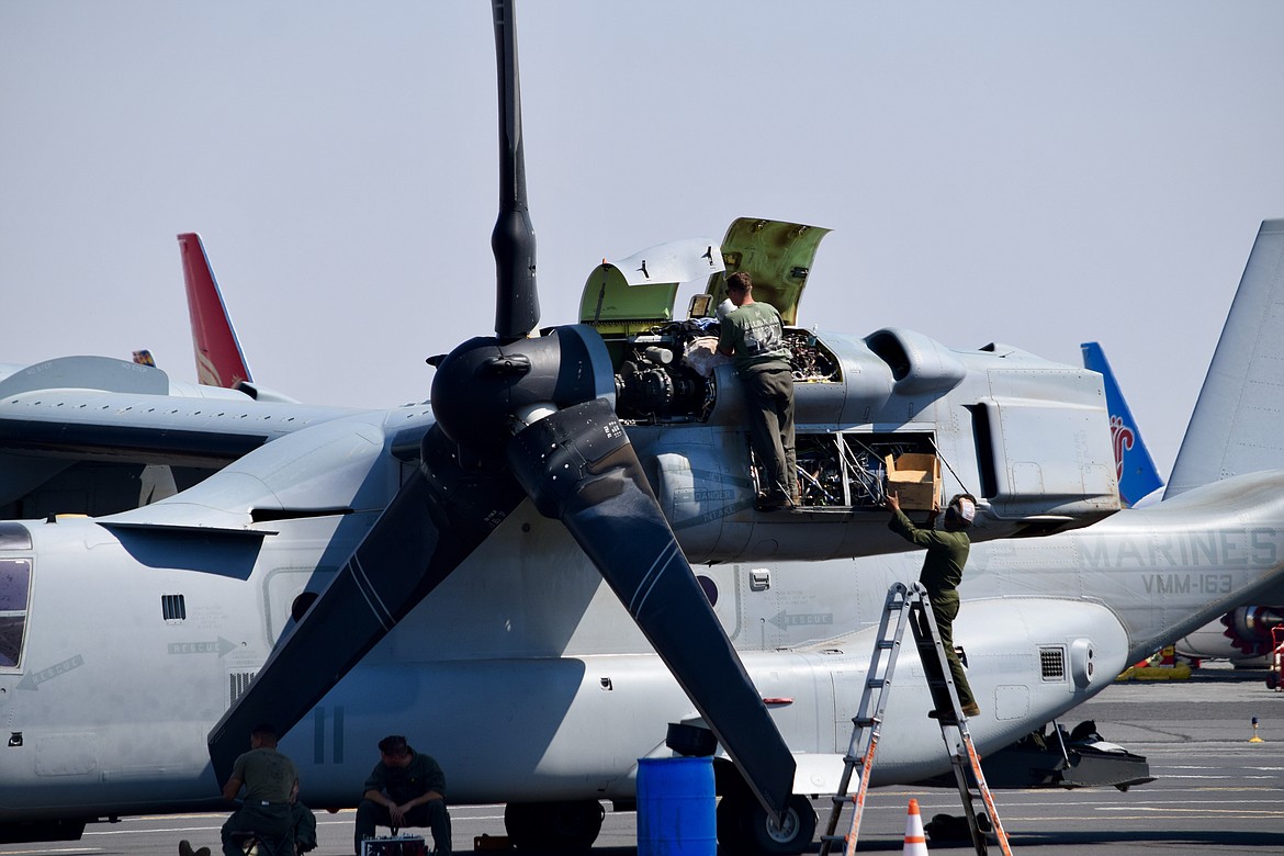 Marine Corps mechanics work on the engine of an MV-22 Osprey transport aircraft Monday at the Grant County International Airport. According to GCIA Director Rich Mueller, the aircraft — which was in Moses Lake as part of the Marines’ Summer Fury 21 exercise last week — broke down during the exercise, and is expected to be repaired soon. “They have a lot of moving parts,” Mueller said.