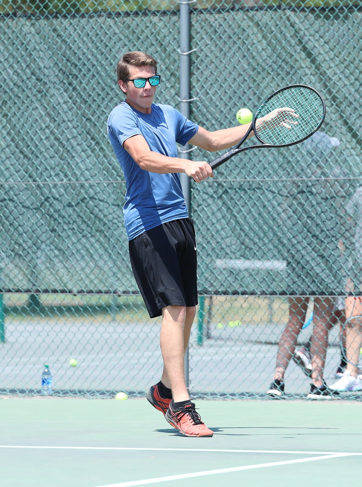 Tyler Korn hits a backhand on Monday.