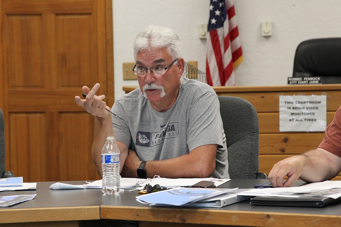 Troy Mayor Dallas Carr discusses the municipality's power system with city councilors and Power Manager Clay Campbell on July 7. (Will Langhorne/The Western News)