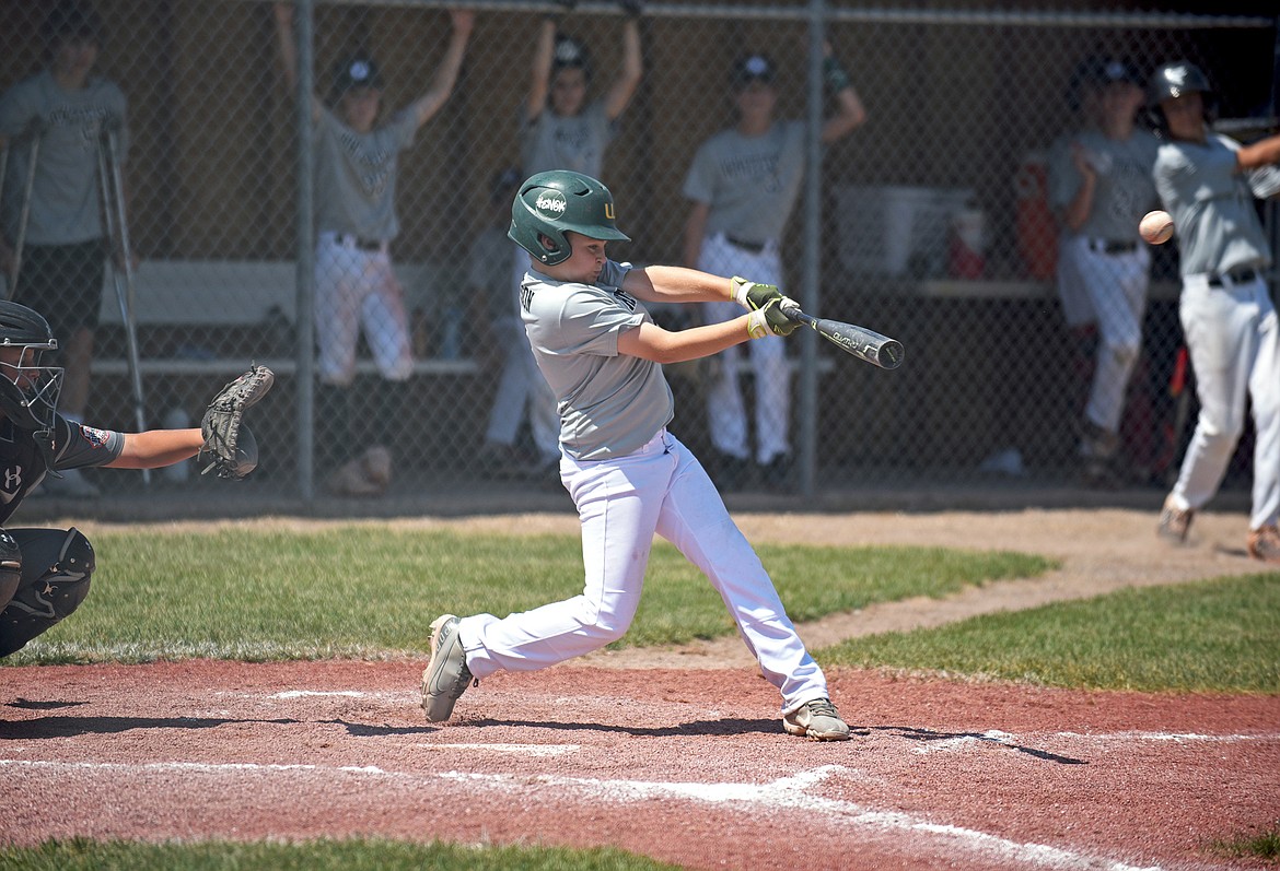 Whitefish's Will Sisson makes contact with the ball for a hit in a baseball game Friday against Mission during the Cal Ripken 12U Montana State Tournament in Whitefish. (Whitney England/Whitefish Pilot)