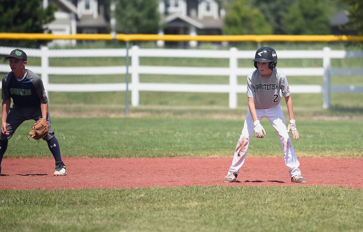Whitefish's Drew Queen takes a lead off second base while watching the ball in a baseball game Friday against Mission during the Cal Ripken 12U Montana State Tournament in Whitefish. (Whitney England/Whitefish Pilot)