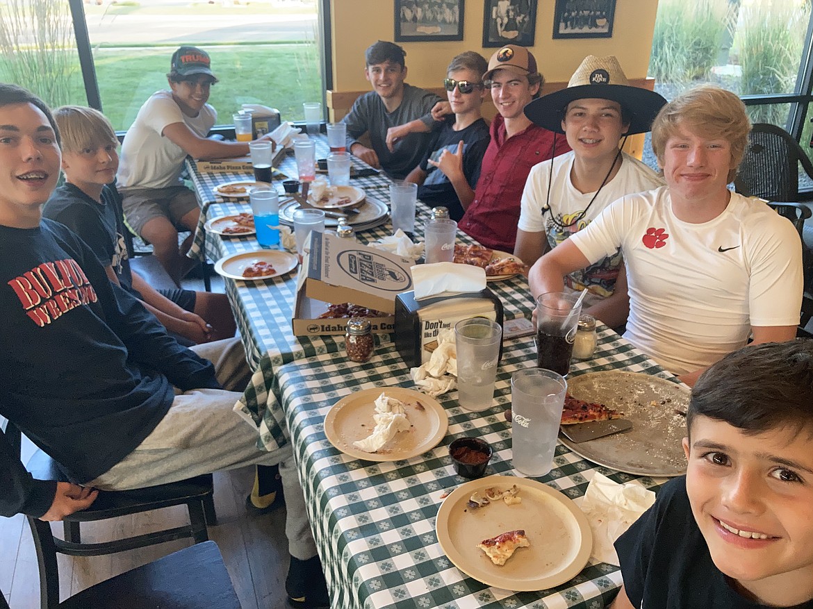 Bulldogs enjoy a team meal during the Wildcat Wrestling Camp last week in Nampa.