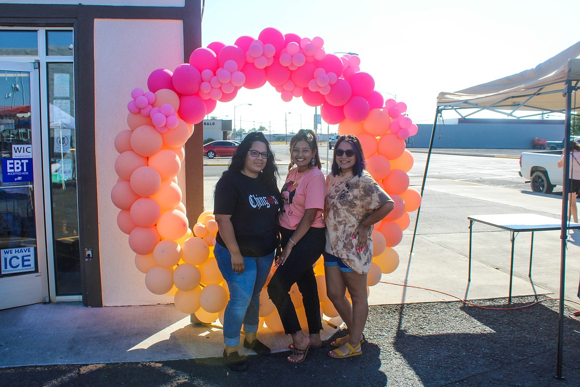 Left to right: She Se Puede organizers Lydia Pearson, Bre Verduzco and Karen Vazquez pose at their market Sunday evening.