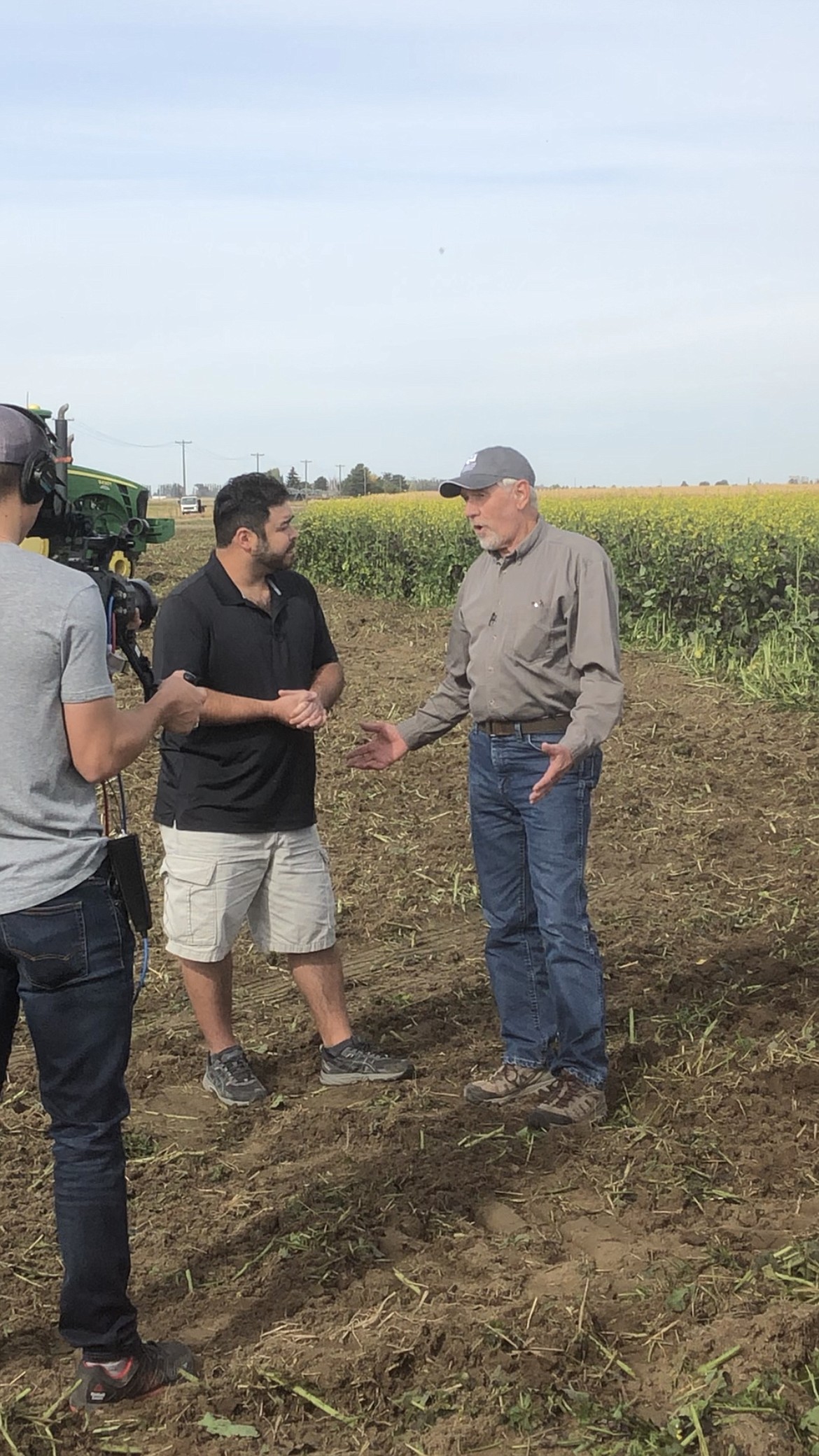 Harold Crose, right, gives an interview for a 2019 “Washington Grown” TV episode on soil health and cover cropping.