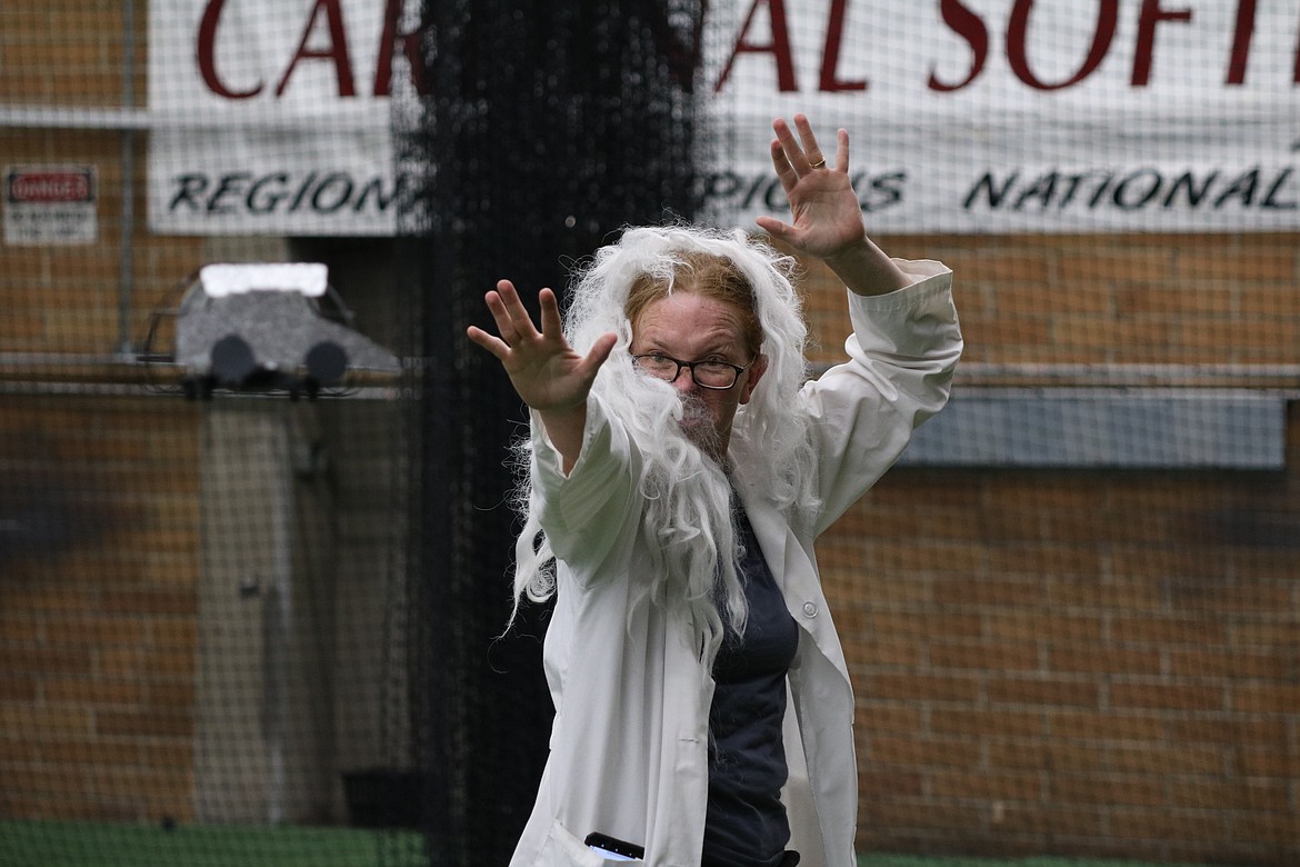 Lynette Leonard, a teacher at Southside Elementary School, dresses as the scientist from "Back to the Future" for her team's themed final showcase on Wednesday at North Idaho College. The three-day drone training was conducted through PCS Edventures and funded through grants by the Idaho STEM Action Center. HANNAH NEFF/Press