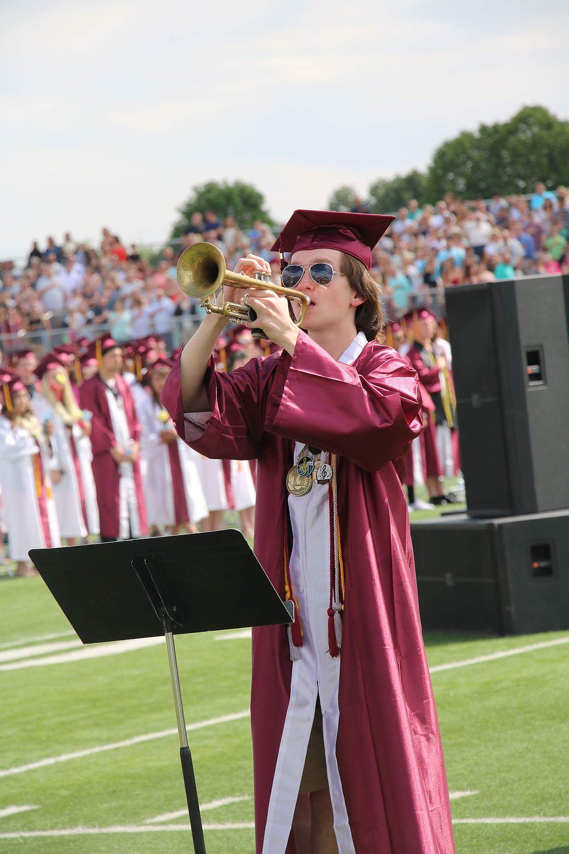 Nathan Fisher plays trumpet at his 2017 Moses Lake High School graduation ceremony at Lions Field in Moses Lake.