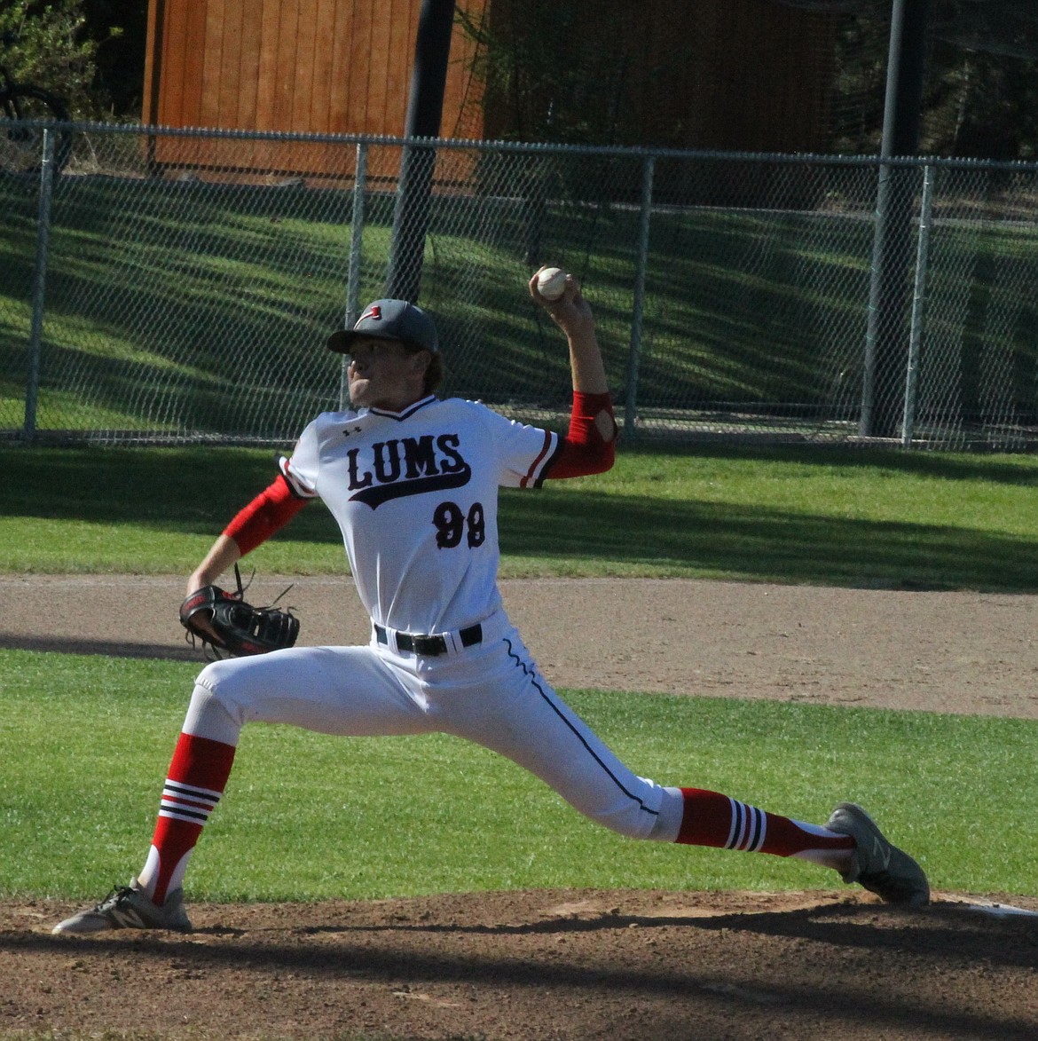 JASON ELLIOTT/Press
Coeur d'Alene Lumbermen pitcher Liam Paddack fires a strike during Thursday's game against Lewis-Clark at Thorco Field. Paddack struck out 12 in 4 1/3 innings.
