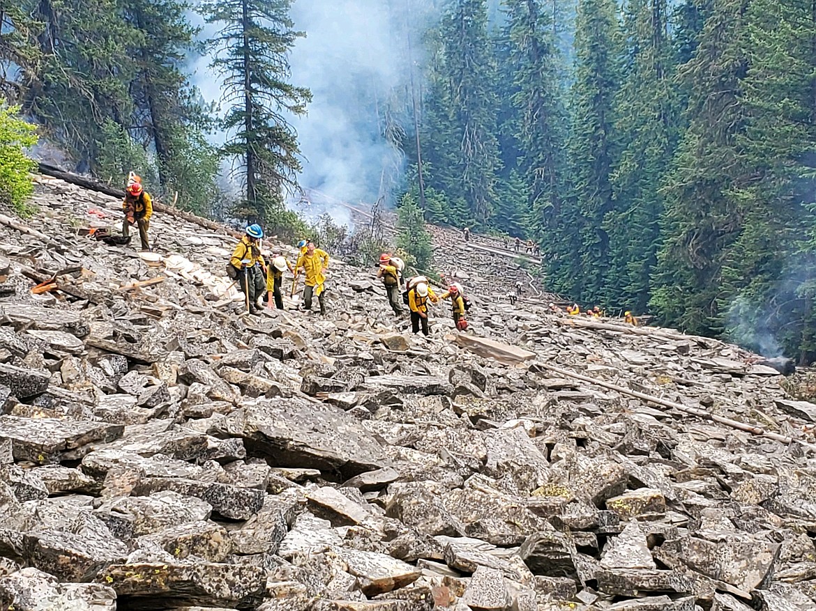 Firefighters work to contain the Burnt Peak Fire on steep terrain. (Courtesy of Tyler Bothman)
