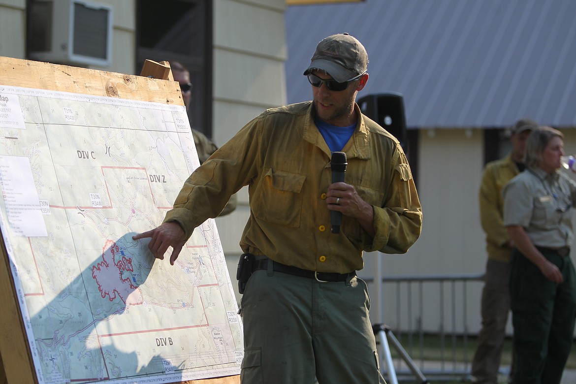 Cory Farmer, U.S. Forest Service incident commander trainee on the Burnt Peak Fire, briefs residents on containment efforts during a July 13 meeting at the Three Rivers Ranger District. (Will Langhorne/The Western News)