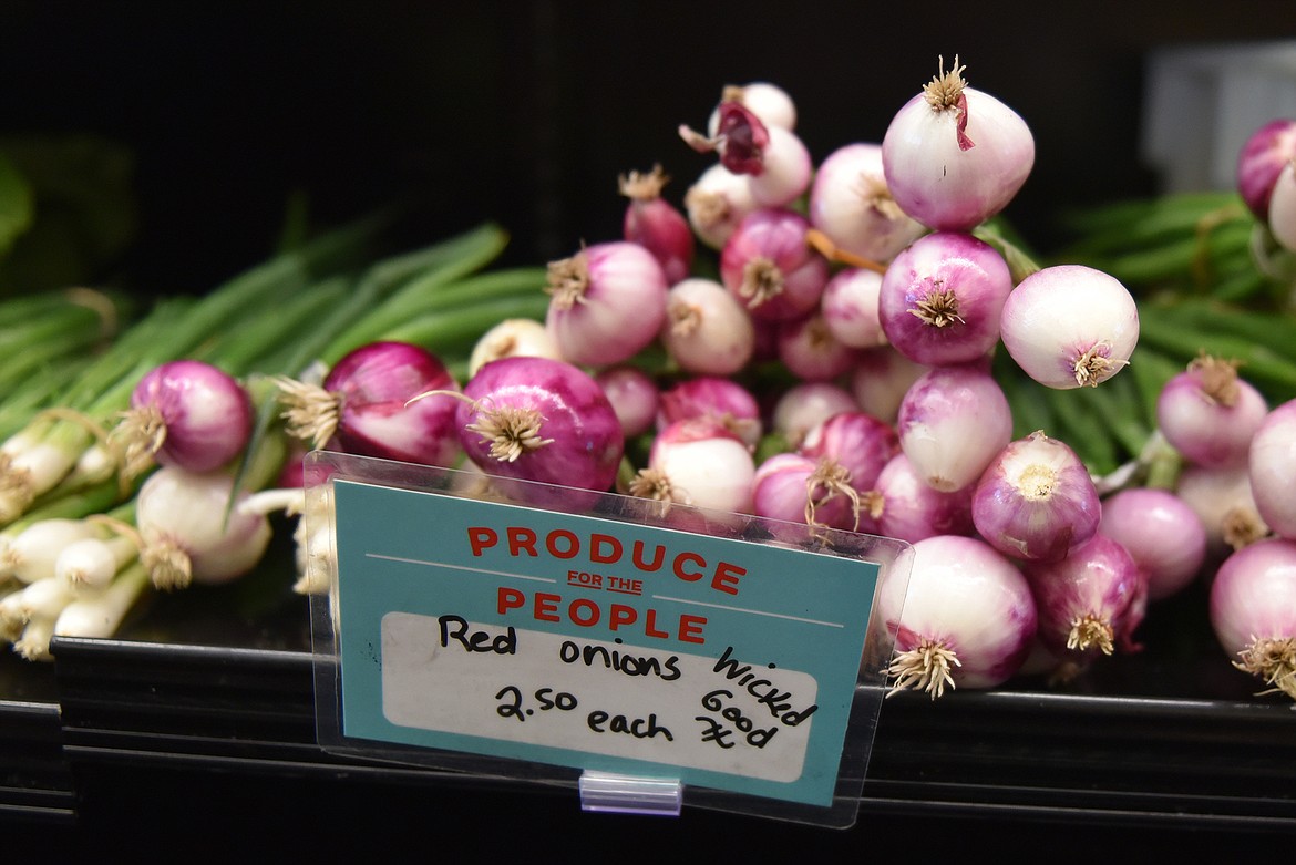 At the Farmers’ Stand market, produce is labeled with its price along with the farm where it was grown. (Heidi Desch/Whitefish Pilot)