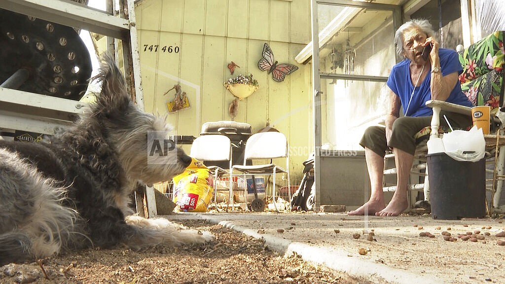 Beverly Houdyshell, 79, who's home burned down, sits at her granddaughter's house in Doyle, Calif. on Tuesday, July 13, 2021. Houdyshell, said Tuesday that she's too old and too poor to rebuild and isn't sure what her future holds. "What chance do I have to build another house, to have another home?" Houdyshell said. "No chance at all." Damage was still being tallied in the rural community of Doyle, Calif., where flames swept in during the weekend and destroyed several homes, including Houdyshell's. (AP Photo/Haven Daley, File)