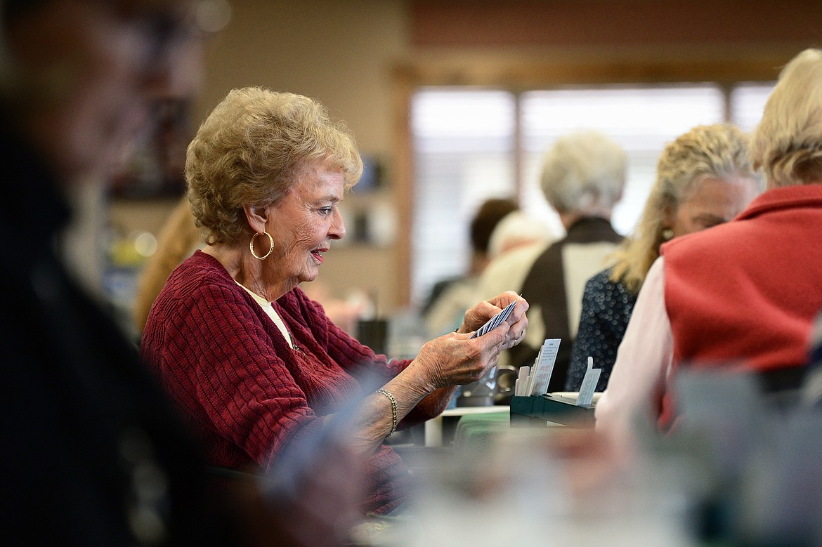 Shirley Heldstab checks her cards during a game of bridge at the Flathead Valley Bridge Center in Kalispell. (Casey Kreider/Daily Inter Lake)